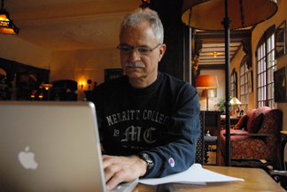 Jon working on computer at the Benbow Inn